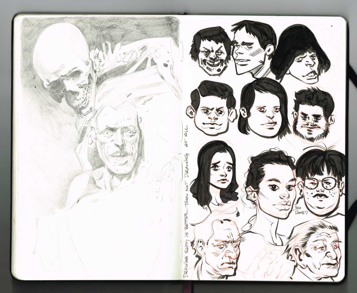 heads and graphite sketch on moleskine sketchbook paper