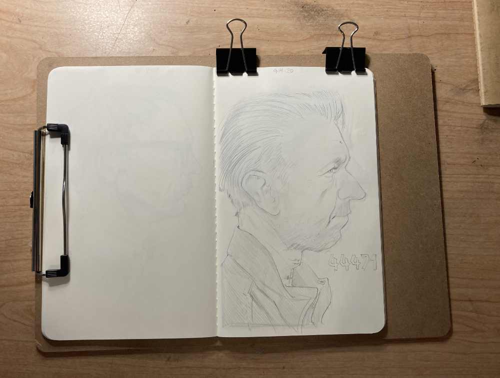 Moleskine Cahier Journal binder clipped to a clipboard